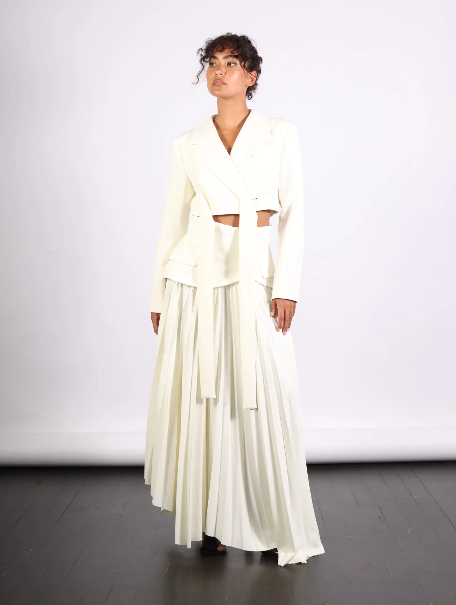 Maxi Pleated Asymmetric Skirt in Ivory by A.W.A.K.E. Mode