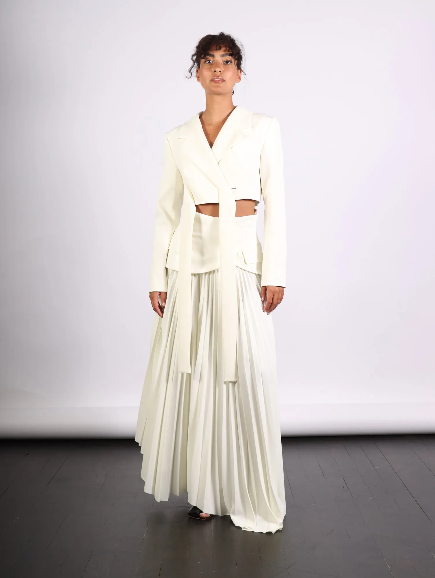 Maxi Pleated Asymmetric Skirt in Ivory by A.W.A.K.E. Mode