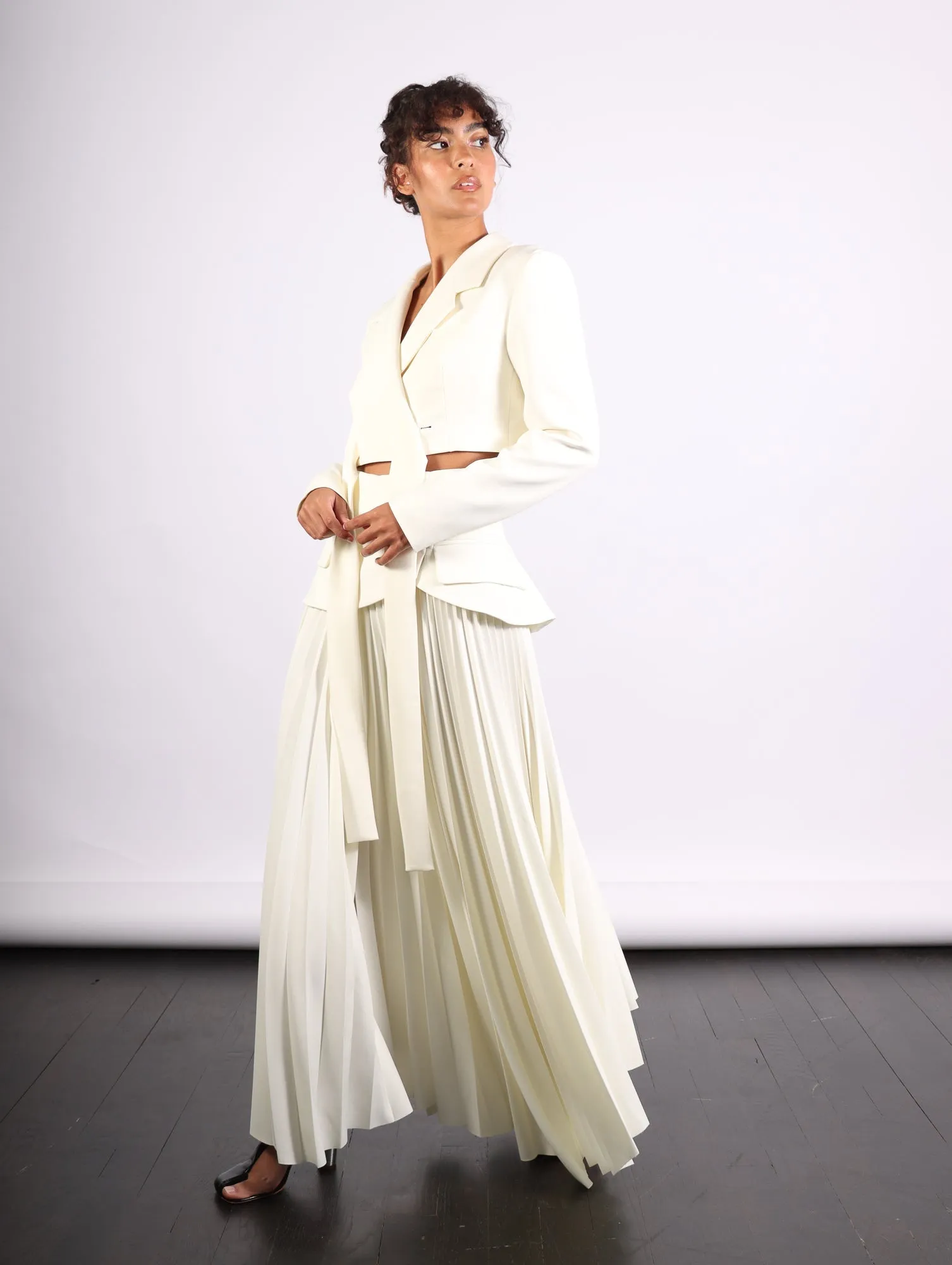 Maxi Pleated Asymmetric Skirt in Ivory by A.W.A.K.E. Mode
