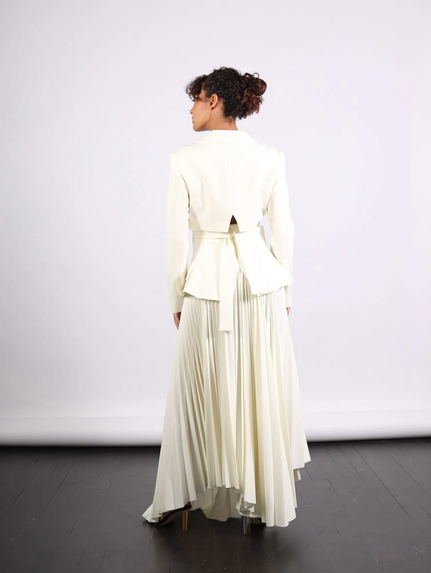 Maxi Pleated Asymmetric Skirt in Ivory by A.W.A.K.E. Mode