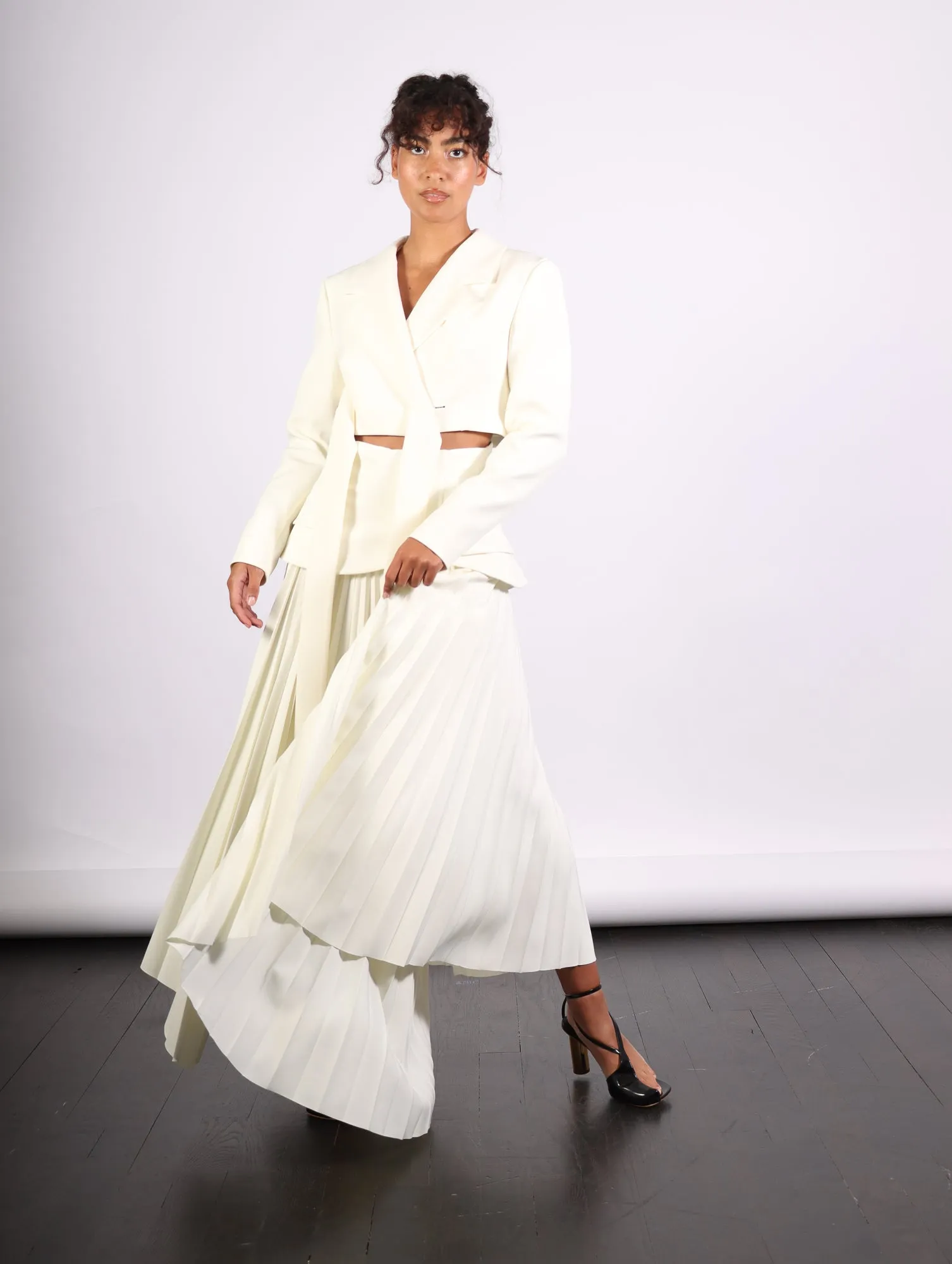 Maxi Pleated Asymmetric Skirt in Ivory by A.W.A.K.E. Mode