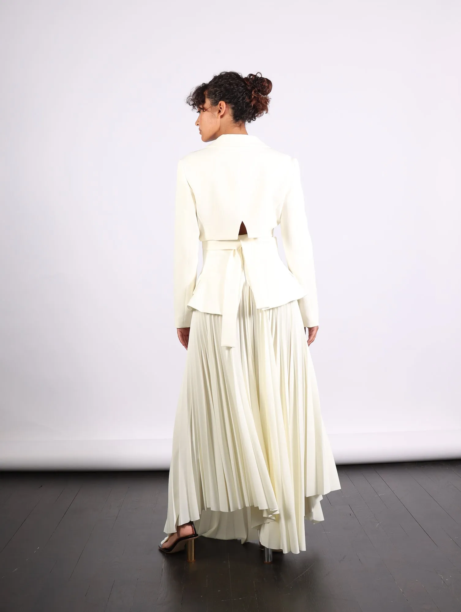 Maxi Pleated Asymmetric Skirt in Ivory by A.W.A.K.E. Mode